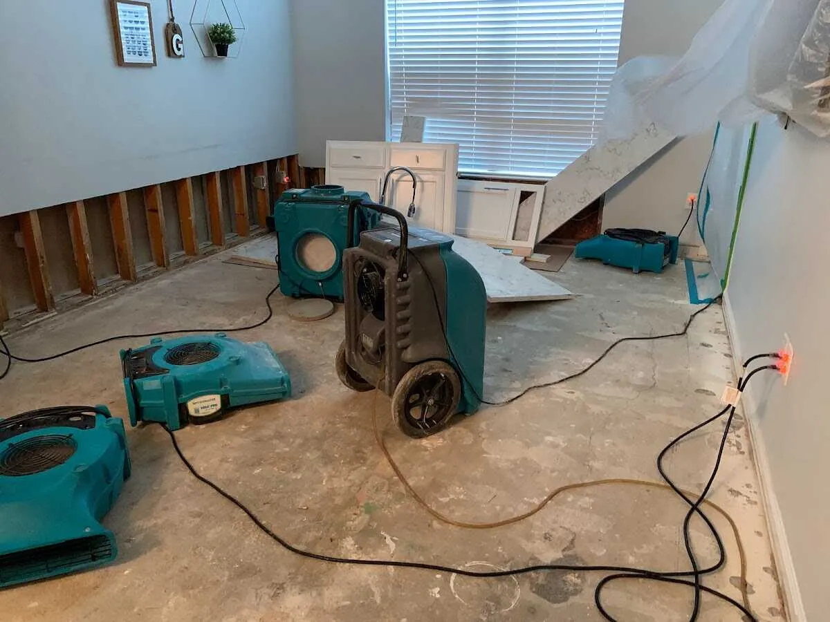 Dehumidifier in flood-cut room for Water Damage Restoration in Hempstead