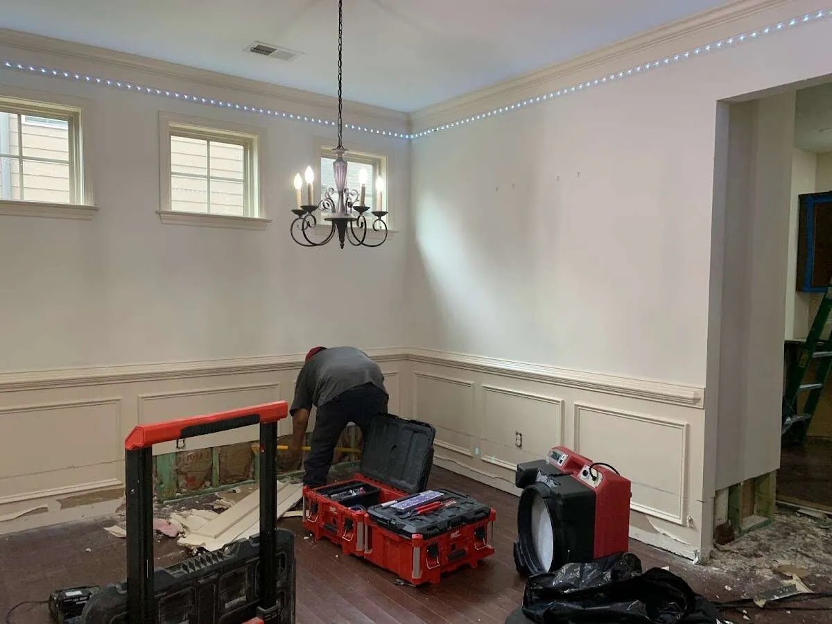 Restoration technician with professional equipment in Hempstead